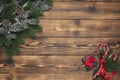 Christmas background with fir tree and gift box, pine cones on wooden table. New year decor top view with copy space Royalty Free Stock Photo