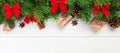 Christmas background with fir tree and gift box on wooden table. Top view with banner copy space for your design Royalty Free Stock Photo