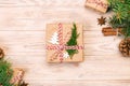 Christmas background with fir tree and gift box on wooden table. Top view vintage, toned with copy space for your design Royalty Free Stock Photo