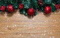 Christmas background with fir tree and red christmas decorations on wood background with snow Royalty Free Stock Photo