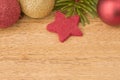 Christmas background with firtree, baubles and stars on wood Royalty Free Stock Photo