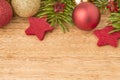 Christmas background with firtree, baubles and stars on wood Royalty Free Stock Photo