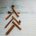 Christmas background food - an unusual Christmas tree made of cinnamon on wooden table. Top view, copy space