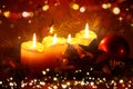 Four Advent candles with red decorations isolated on lights background. Royalty Free Stock Photo