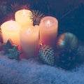 Four pink burning advent candles. Christmas card. Royalty Free Stock Photo