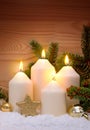 Four burning Advent candles and white snow. Royalty Free Stock Photo