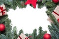 Christmas background frame with fir branches and other decorations presents red stars and bulbs with copy space on white Royalty Free Stock Photo