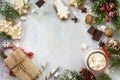 Christmas background frame or greeting xmas card. Gingerbreads and a cup of hot chocolate with a marshmallow on a festive Royalty Free Stock Photo