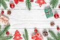 Christmas background. frame made of fir branches, decorations, berries, candy, gift boxes and pine cones. flat lay Royalty Free Stock Photo