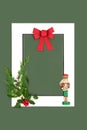 Christmas Background Frame with Nutcracker Flora and Red Bow Royalty Free Stock Photo