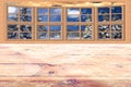 Christmas background frozen wooden table with window viewing on a snowing forest landscape