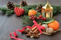 Christmas background with fruits, spices, fir, candle and decorations