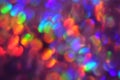 Christmas background, garland in blur. Glowing and festive rainbow light circles created in camera and bokeh lens. Christmas fairy