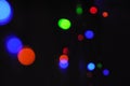 Christmas background, garland lights, glass ball, toys, glare night. New Year`s toys and ornaments Royalty Free Stock Photo