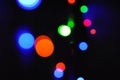 Christmas background, garland lights, glass ball, toys, glare night. New Year`s toys and ornaments background theme Royalty Free Stock Photo