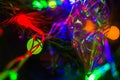 Christmas background-garlands with colorful lights on a decorated Christmas tree, bokeh Royalty Free Stock Photo