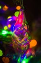 Christmas background-garlands with colorful lights on a decorated Christmas tree, bokeh Royalty Free Stock Photo