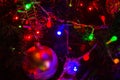 Christmas background-garlands with colorful lights on a decorated Christmas tree, bokeh Royalty Free Stock Photo