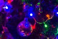 Christmas background-garlands with colorful lights on a decorated Christmas tree, bokeh Royalty Free Stock Photo