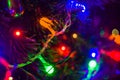 Christmas background-garlands with colorful lights on a decorated Christmas tree, bokeh Royalty Free Stock Photo