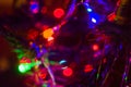 Christmas background-garlands with colorful lights on a decorated Christmas tree, bokeh Royalty Free Stock Photo