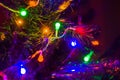 Christmas background-garlands with colorful lights on a decorated Christmas tree, bokeh Royalty Free Stock Photo