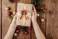 Christmas background with gift boxes, paper`s rools and decorations on red. Preparation for holidays. Top view with copy space.