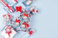 Christmas background - gift boxes in red, blue and silver metallic color with ribbons and bows, decorations, top view, copy space. Royalty Free Stock Photo