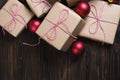 Christmas gifts box presents with red balls on wooden background top view text space Royalty Free Stock Photo