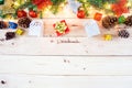 Christmas background with gift and christmas Decoration , christmas tree and pine cones on wooden table. Top view with copy space Royalty Free Stock Photo