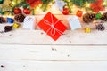 Christmas background with gift and christmas Decoration , christmas tree and pine cones on wooden table. Top view with copy space Royalty Free Stock Photo