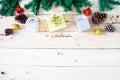 Christmas background with gift and christmas Decoration , christmas tree and pine cones on wooden table. Top view with copy space Royalty Free Stock Photo