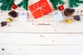 Christmas background with gift and christmas Decoration , christmas tree and pine cones on wooden table. Top view with copy space Royalty Free Stock Photo