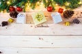 Christmas background with gift and christmas Decoration , christmas tree and pine cones on wooden table. Top view with copy space Royalty Free Stock Photo