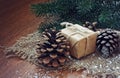 Christmas background with gift, fir tree cone
