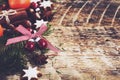 Christmas background with gingerbread cookie stars, fir tree twigs Royalty Free Stock Photo