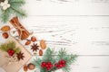 Christmas background with gingerbread cookies, fir branches and presents in boxes on the old wooden board. Copy space. Royalty Free Stock Photo