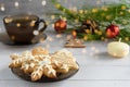 Christmas background. Gingerbread cookies, tea, Christmas tree branches, Christmas toys and candles Royalty Free Stock Photo
