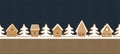 Christmas background. Gingerbread village. Seamless border. Gingerbread houses and fir trees on knitted background Royalty Free Stock Photo