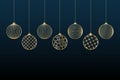 Christmas background Gold balls toy on a blue background Festive background for Christmas and New Year Pattern of gold line toy