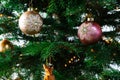 Beautiful decorated Christmas tree. with various hanging Christmas balls on the tree, Christmas background, gold and pink balls