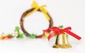 Christmas background, golden bells with red ribbon