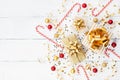 Christmas background of golden confetti, gift or present boxes and holiday decorations top view. Flat lay. Royalty Free Stock Photo