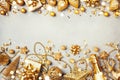 Christmas background with golden gift or present box, champagne and holiday decorations top view. Greeting card. Flat lay style Royalty Free Stock Photo