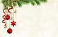 Christmas background with green pine twigs, hanging red decorations and silk twisted ribbons Royalty Free Stock Photo