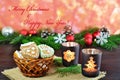 Christmas background, greeting card with burning candle and gingerbread cookies Royalty Free Stock Photo