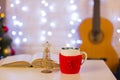 Christmas background with guitar.Still life in the home interior