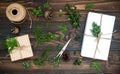Christmas background with hand crafted gifts, presents on rustic wooden table. Overhead, flat lay, top view