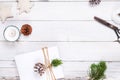 Christmas background with handmade present gift boxes and rustic decoration on white wooden board Royalty Free Stock Photo