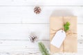 Christmas background with handmade present gift boxes and rustic decoration on white wooden board. Royalty Free Stock Photo